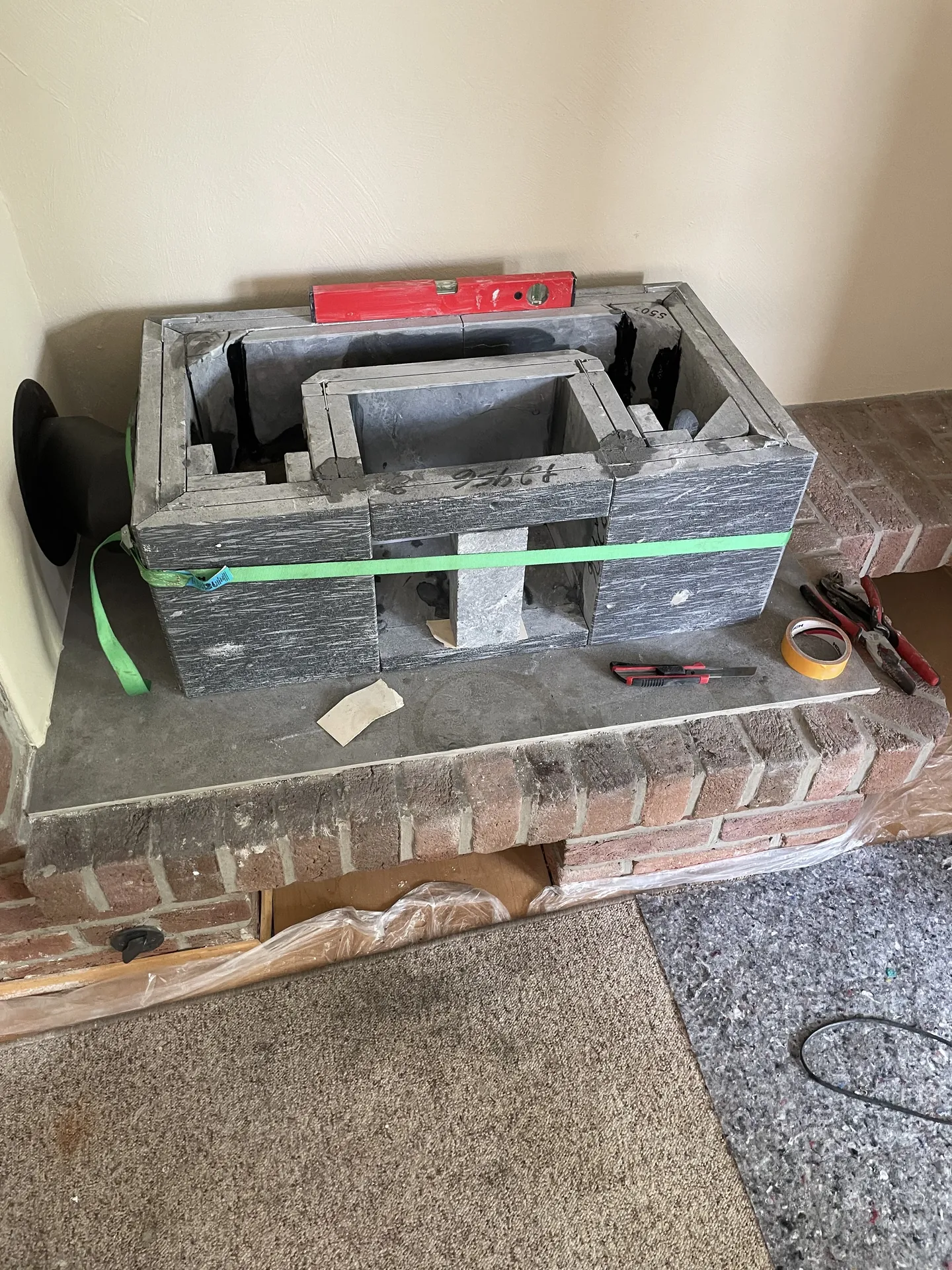 Soapstone masonry heater: the firebox takes shape