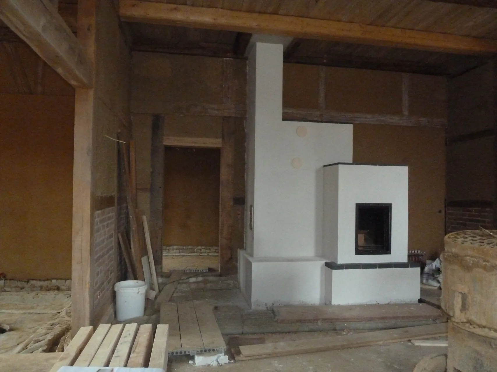 Masonry heater in a half-timbered house